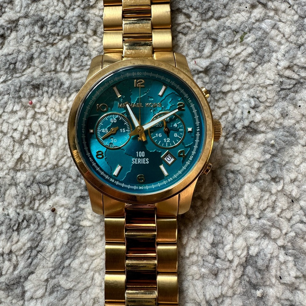Michael Kors “Watch Hunger Stop” watch